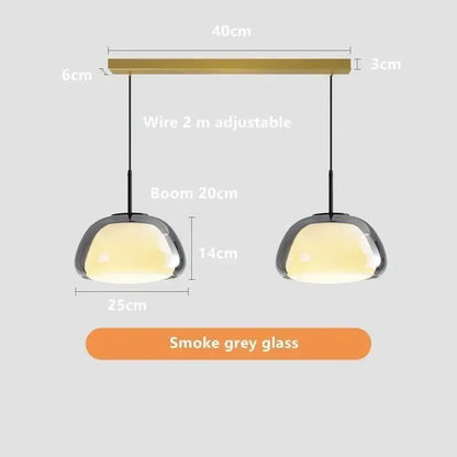 Modern minimalist jelly pendant lamp featuring smoke grey glass shades and brass-finished bar for living room lighting