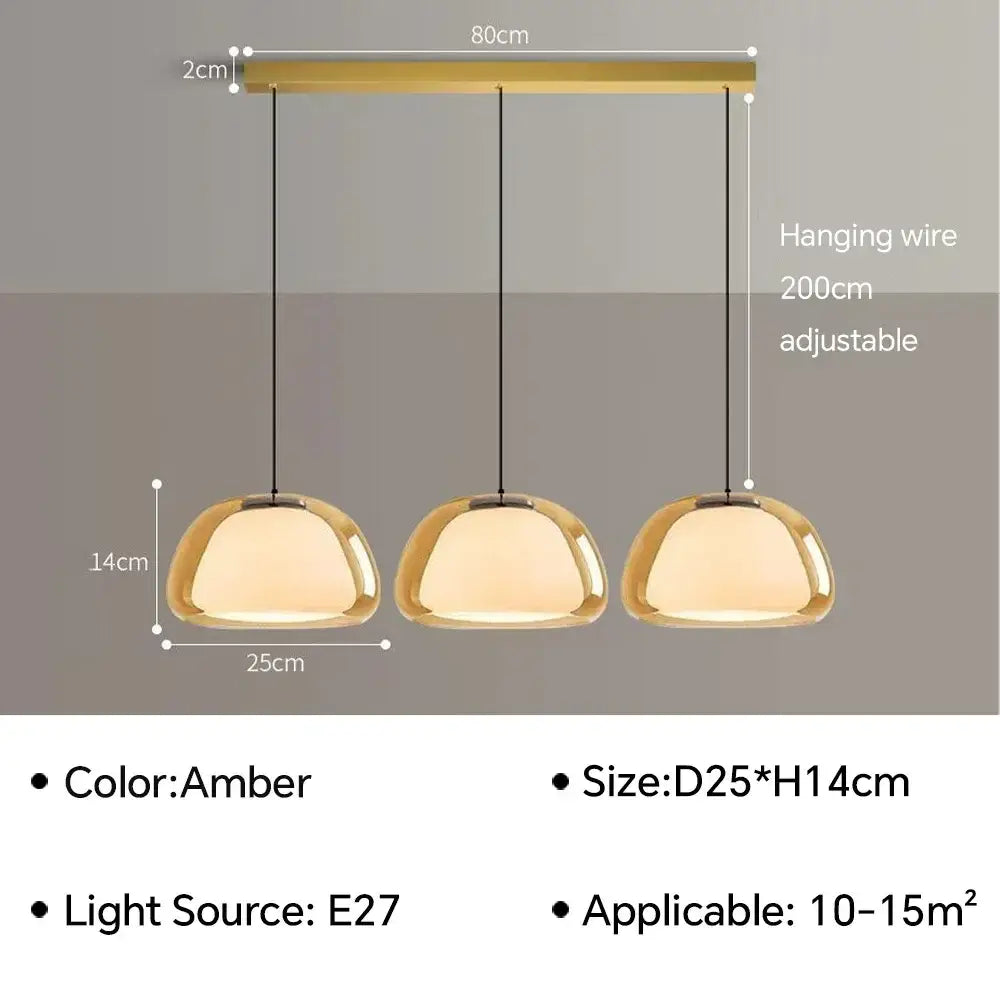 Set of three amber glass jelly pendant lamps with a modern minimalist design for living room lighting