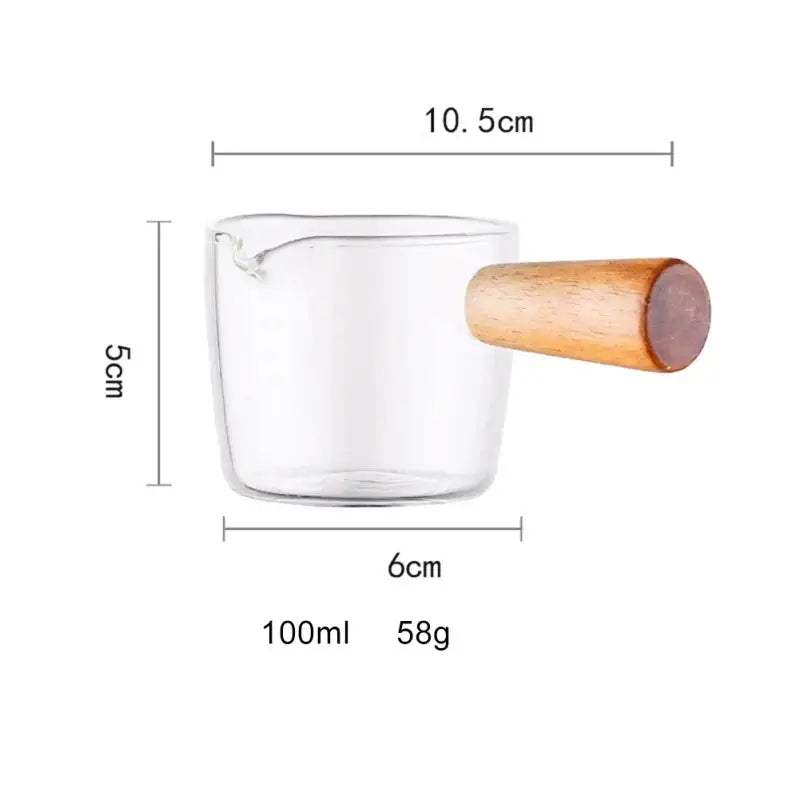Minimalist clear glass sauce dish with wooden handle holding 100ml liquid as a glass sauce dish or gravy boat