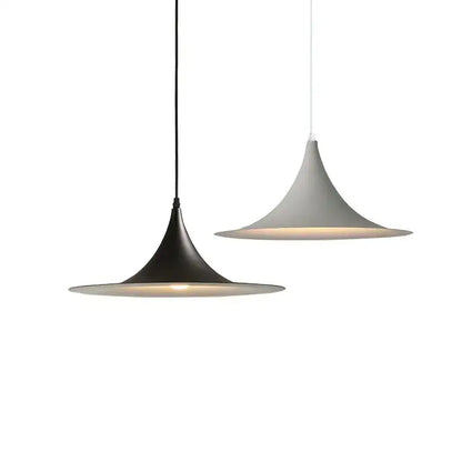 Two modern pendant lights with black and white matte shades hang as a minimalist decorbites horn chandelier pendant