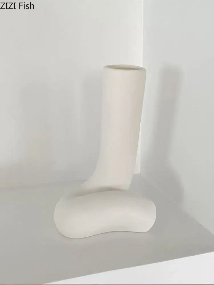 Cream-colored ceramic human body vase with sleek minimalist abstract boot design for bedroom decorbites abstract human decor