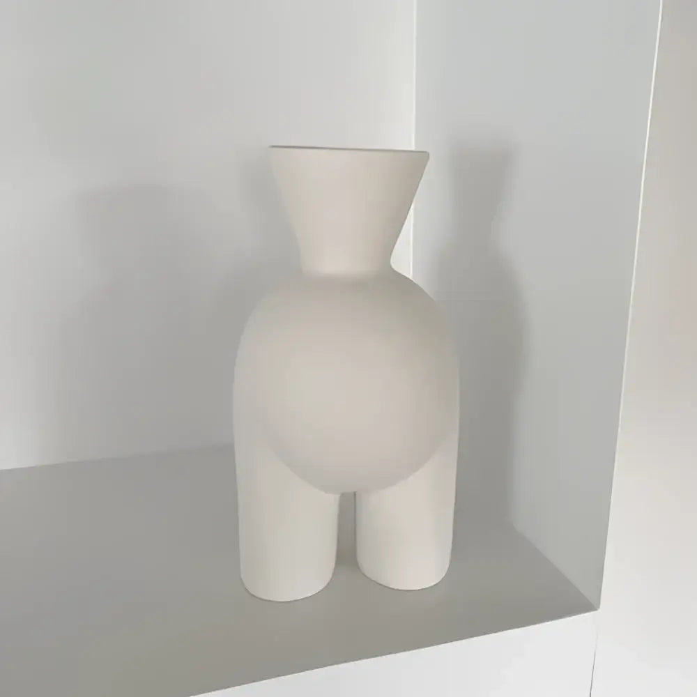 Minimalist cream abstract human body ceramic vase with a sculpted form and narrow neck for bedroom decorbites decor