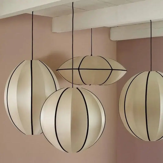 Minimalist cream and black geometric pendant light with segmented spherical design for dining room decorbites danish pendant