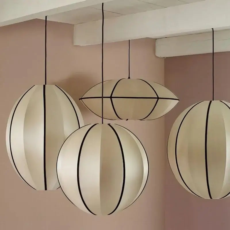 Minimalist cream and black geometric pendant light with segmented spherical design for dining room decorbites danish pendant