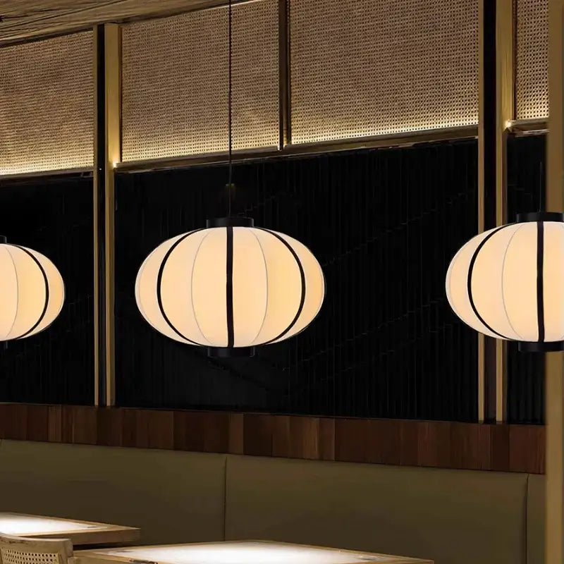 Minimalist cream and black spherical pendant light with black vertical stripes for dining room decorbites danish pendant light