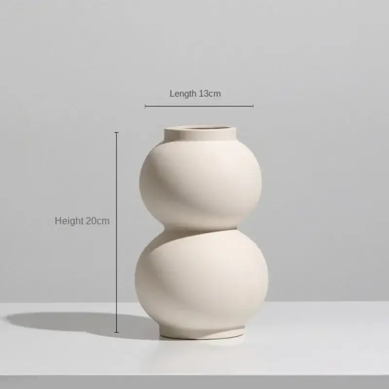 Minimalist cream ceramic art vase with sleek double-sphere design for living room decorbites ceramic art decor