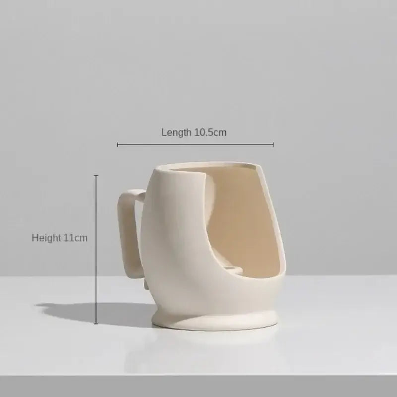 Minimalist cream decorbites ceramic art vase with an asymmetrical open-sided design and sturdy handle for living room decor