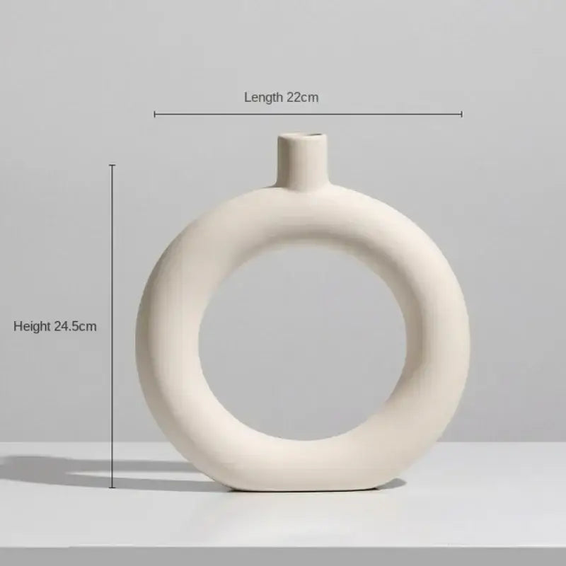 Minimalist cream ceramic art vase with a ring design and slender neck for decorbites ceramic art living room decor