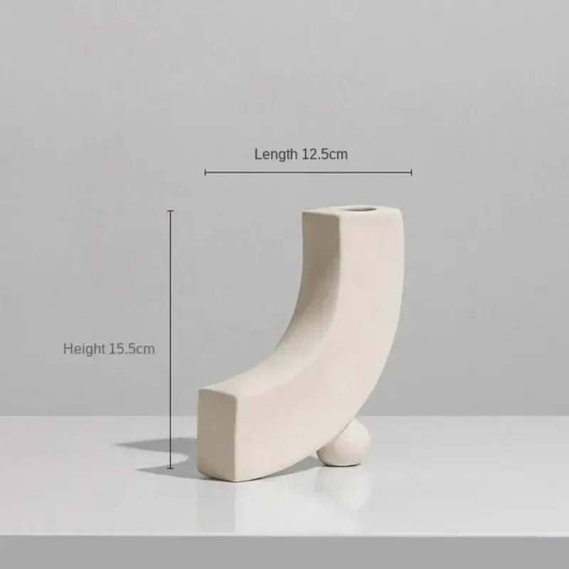 Minimalist cream ceramic art vase with sleek curved design and small spherical base for decorbites ceramic art decor