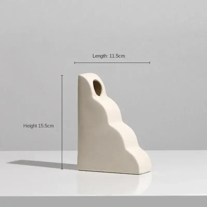 Minimalist cream ceramic art vase with smooth stepped design and oval opening for living room decorbites ceramic decor