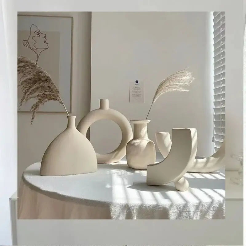 Minimalist cream ceramic art vase with abstract shapes for living room sculptural decor by decorbites ceramic art