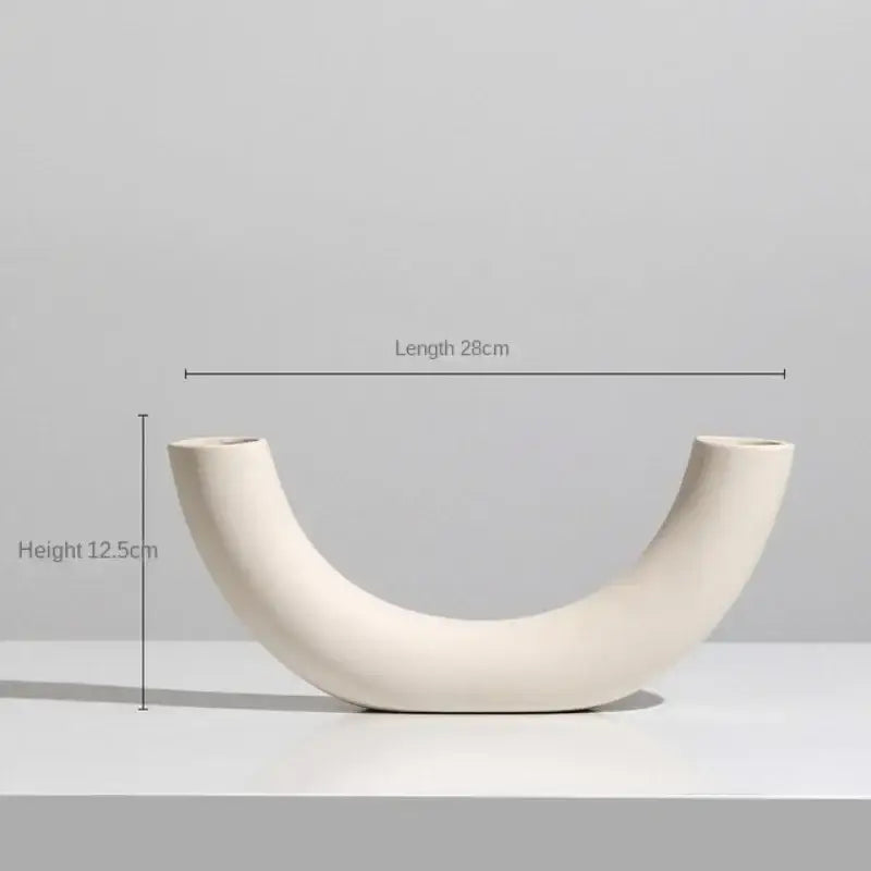 Minimalist cream ceramic art vase with smooth curved u-shape and two open ends by decorbites ceramic art decor