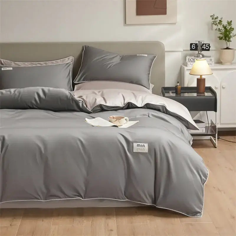 Gray satin duvet cover set with white piping and min label corner in minimalist cream and green egyptian cotton solid bedding set