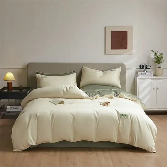 Cream-colored egyptian cotton solid bedding set with subtle green accents and minimalist design for bedroom use