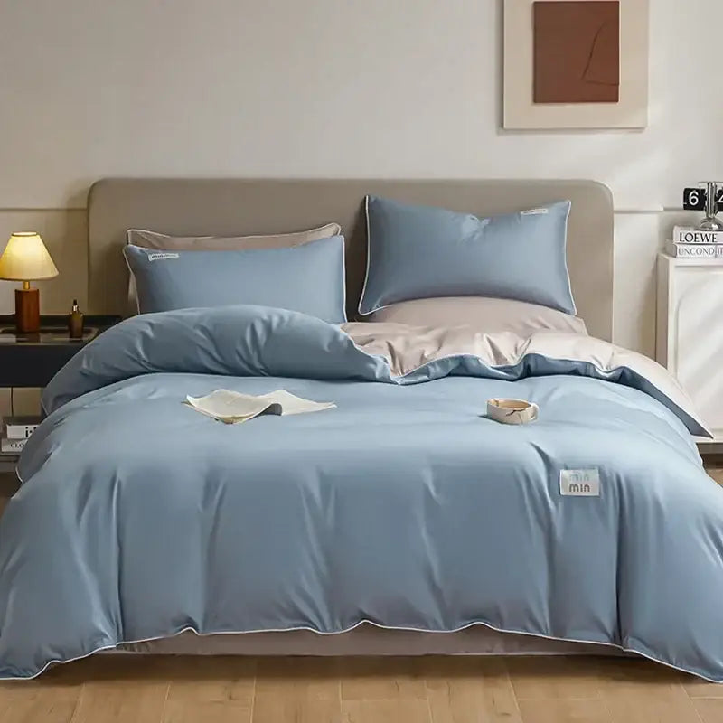 Blue satin duvet cover bedding set with subtle white trim and matching pillows in egyptian cotton solid fabric