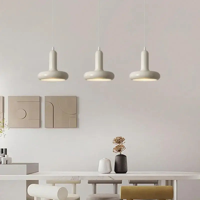 Minimalist cream white ceramic pendant light with sleek cylindrical shades for dining room decorbites pendant light