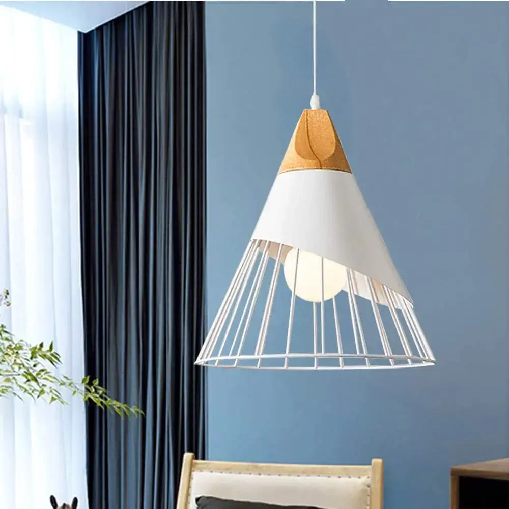 Minimalist crisp white pendant light with wood accent and metal wire cage for kitchen island lighting