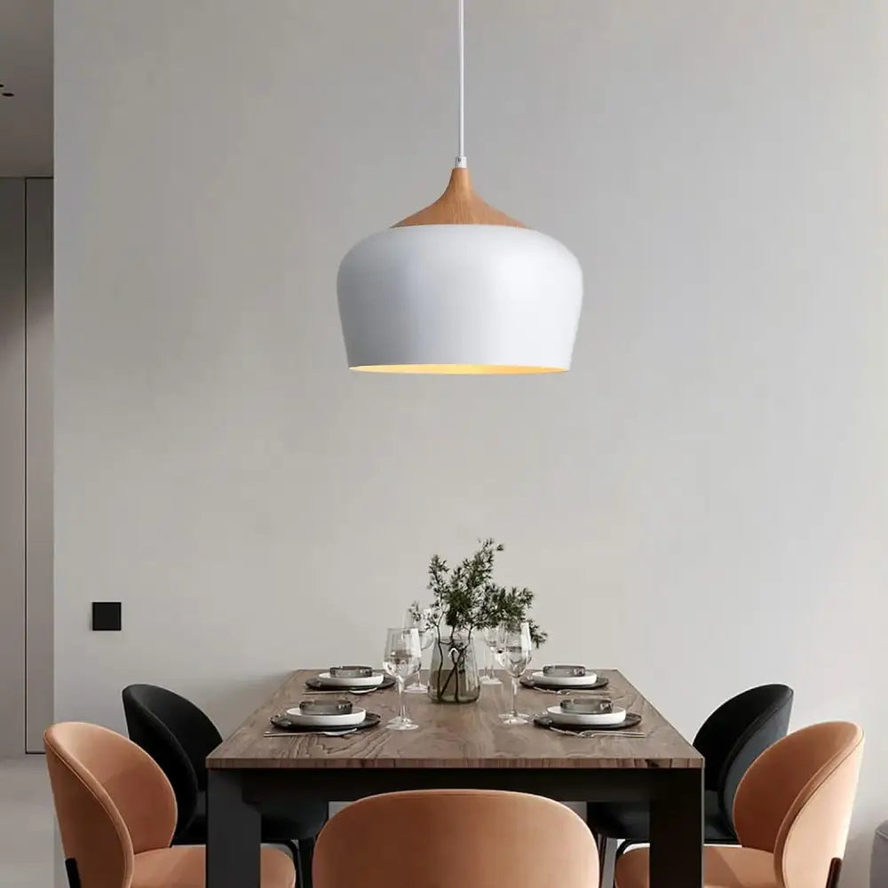 Minimalist pendant light with crisp white finish and wood accent designed for modern kitchen island lighting