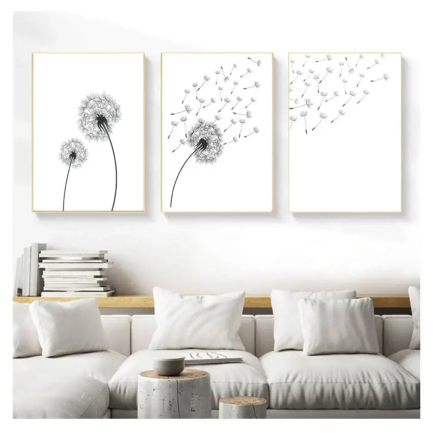 Three framed black and white minimalist dandelion canvas wall art pieces with thin gold frames for wall decoration