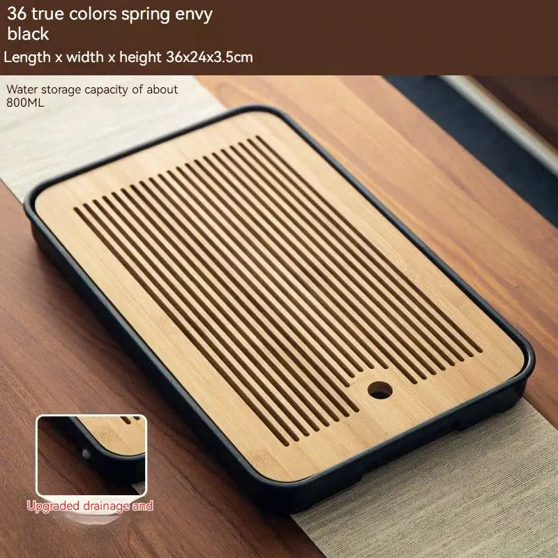 Rectangular minimalist dark brown and black bamboo tea tray with slotted drainage and plastic frame for dining room storage