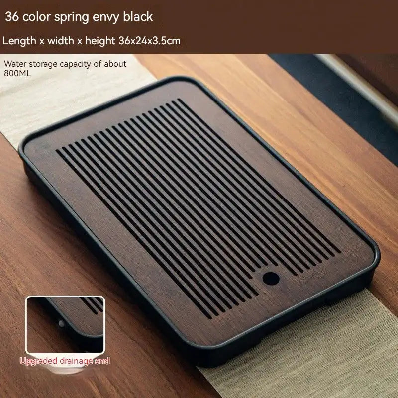 Minimalist dark brown and black bamboo tea tray with parallel slits for drainage ideal for dining room storage