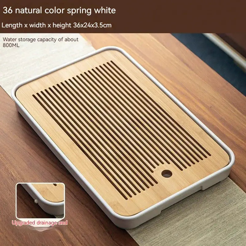 Minimalist dark brown and black rectangular bamboo tea tray with white plastic rim and slotted drainage design for dining room storage