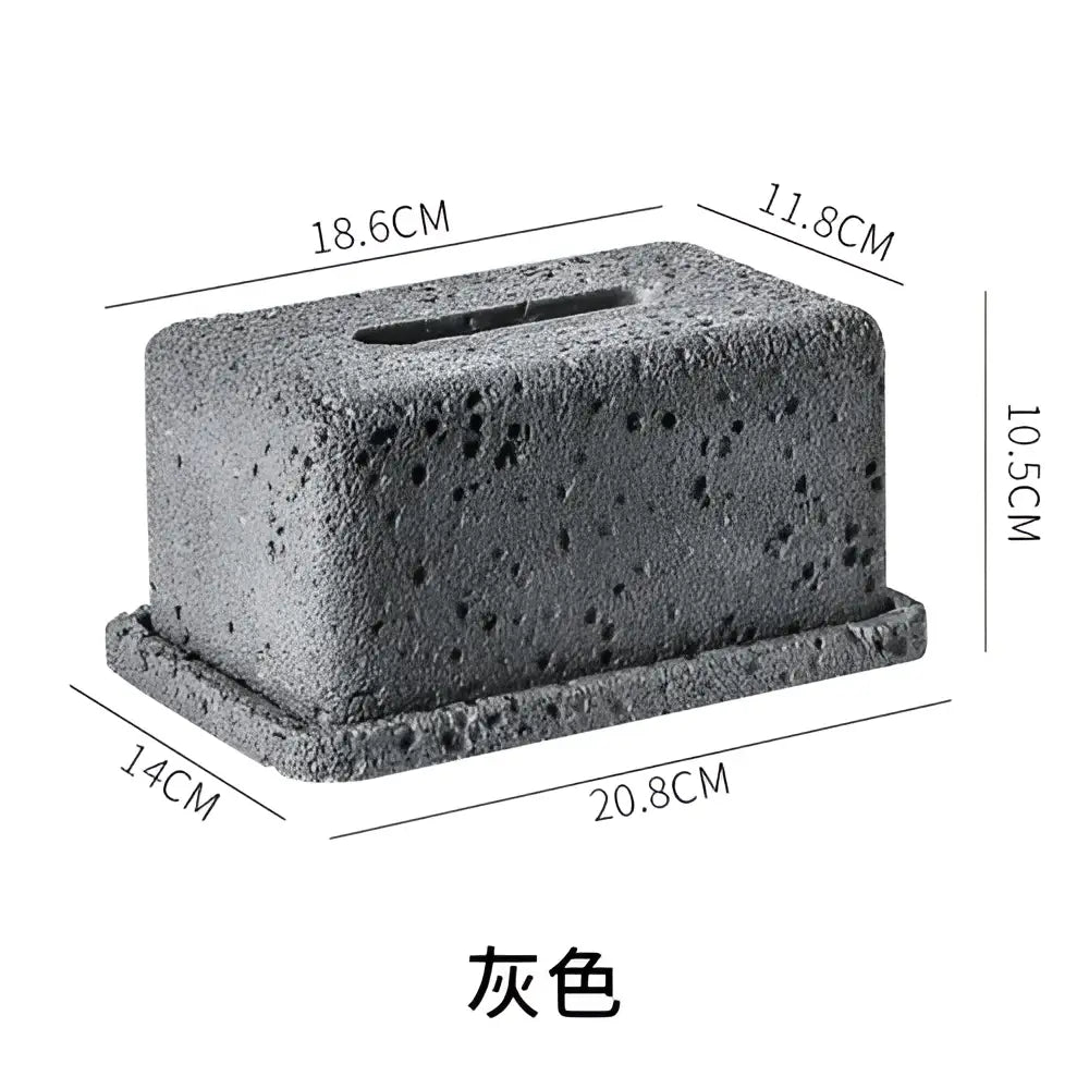 Minimalist dark gray concrete tissue box rack with a textured porous surface for kitchen decor use