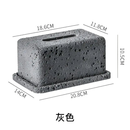 Minimalist dark gray concrete tissue box rack with a textured porous surface for kitchen decor use