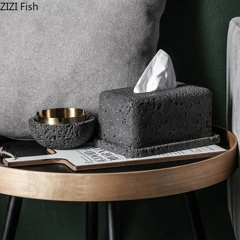 Minimalist dark gray concrete tissue box rack with textured stone tissue box and white tissue partially pulled out