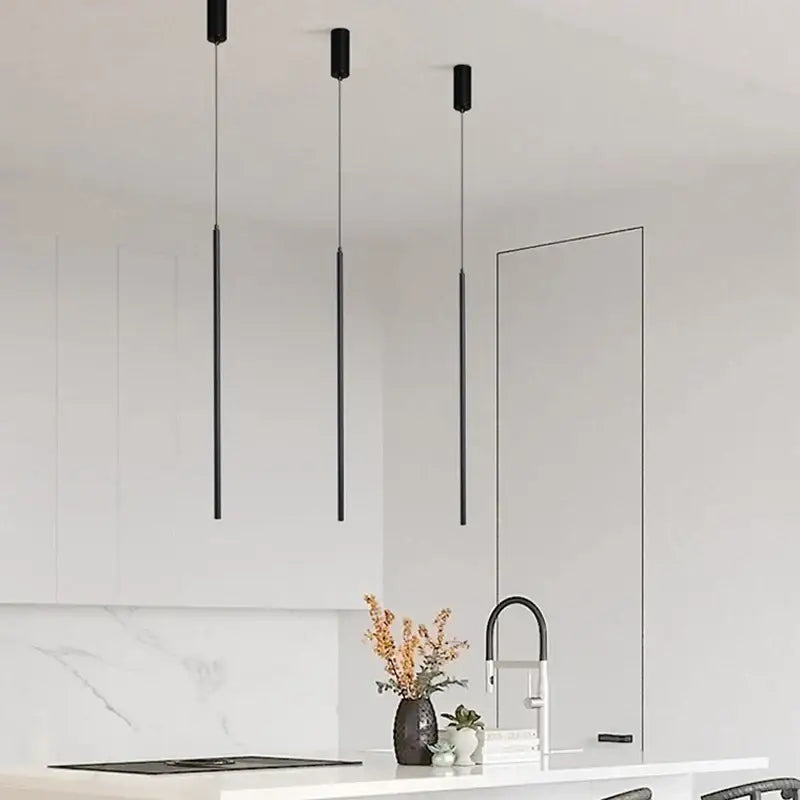 Three sleek black cylindrical decorbites black slim led pendant lamps hanging for dining room light fixture
