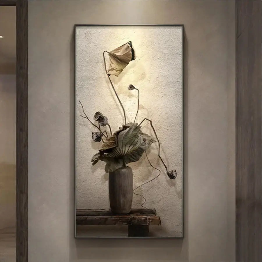 A minimalist earthy led wall lamp featuring a textured dark gray ceramic vase with dried lotus leaves decor