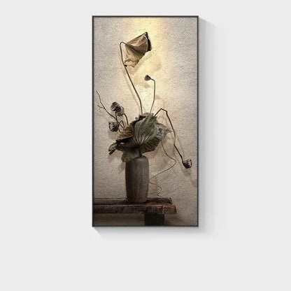 Minimalist earthy led wall lamp with tall gray ceramic vase holding dried lotus leaves against rustic bedroom wall