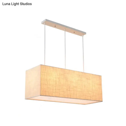 Minimalist rectangle island lighting with warm beige fabric shade and sleek silver metal ceiling mount island lighting fixture