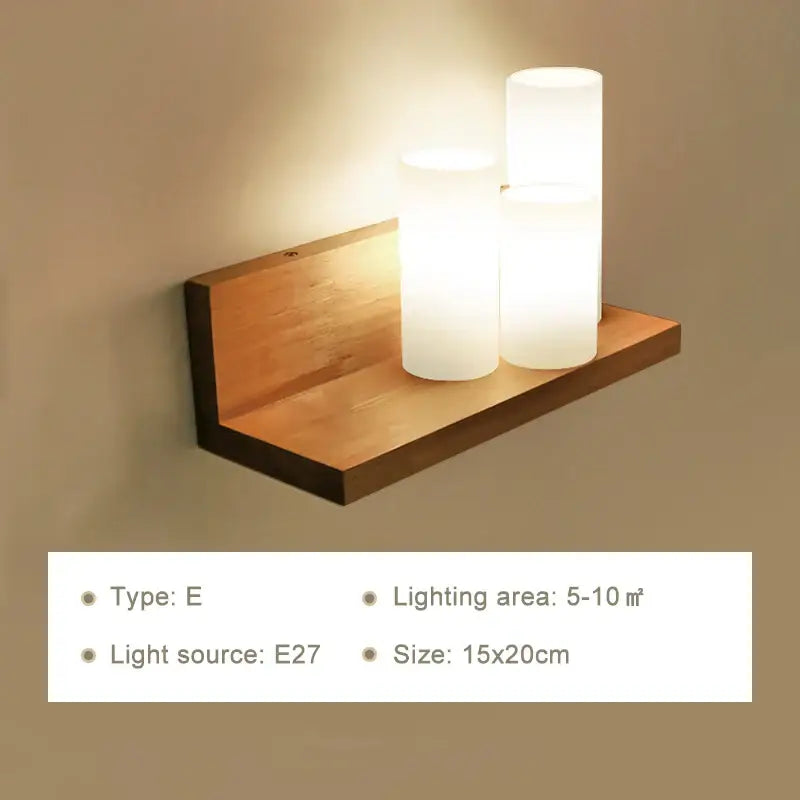 Minimalist wooden wall lamp with three frosted glass cylindrical lights and pull chain for bedroom use