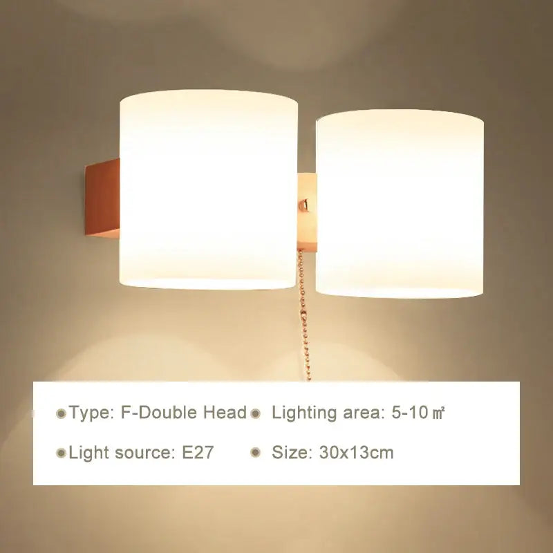 Minimalist warm-toned wooden wall lamp with frosted glass shades and copper mounting for bedroom use with pull chain