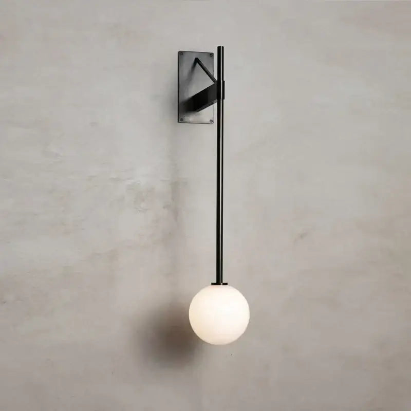 Black metal minimalist geometric iron wall lamp with rectangular plate and white glass globe for bedroom decorbites geometric iron wall