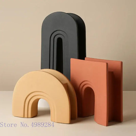 Set of three minimalist geometric stripes ceramic arch-shaped decor in matte black beige and terracotta for living room decor