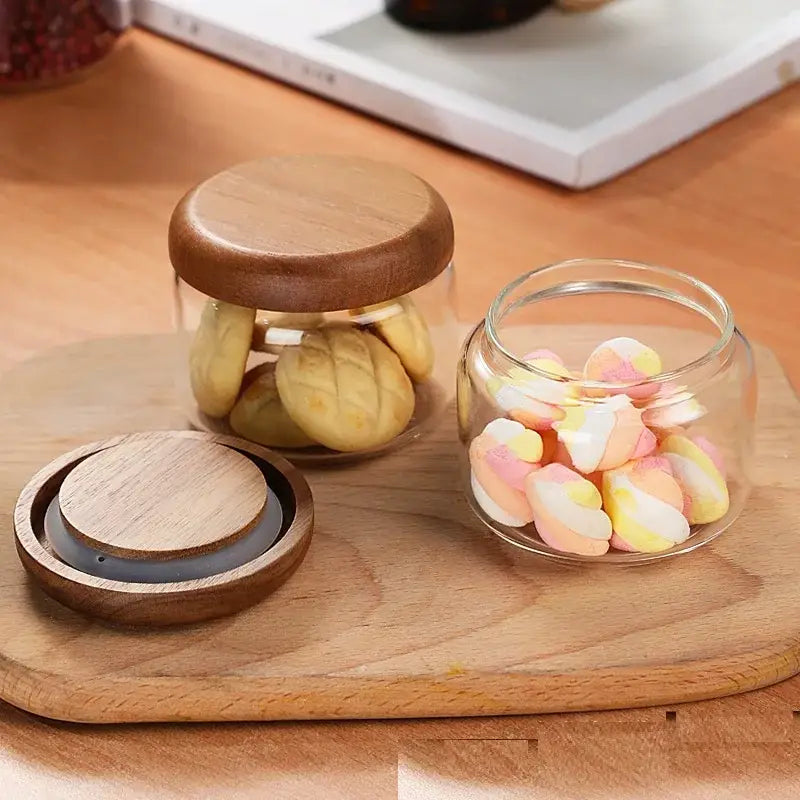 Minimalist glass spice jar with pastel marshmallows and a smooth rounded acacia wood lid for kitchen storage