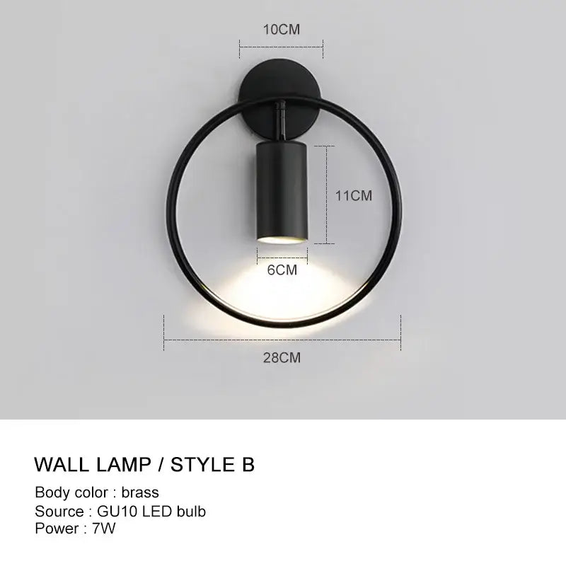 Minimalist gold adjustable angle wall light with black circular lamp and brass-finished base by decorbites wall light