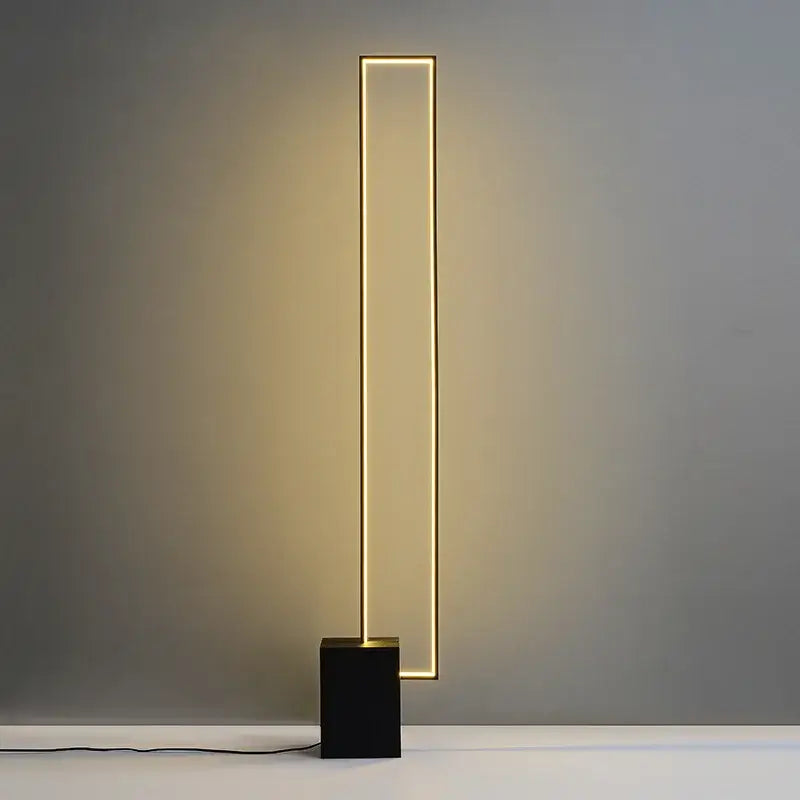 Modern minimalist floor lamp with matte black base and warm gold geometric led decorbites geometric led floor lighting