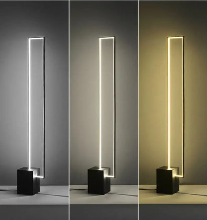 Minimalist gold and black geometric led floor lamp with sleek black cube base and tall rectangular light strip by decorbites