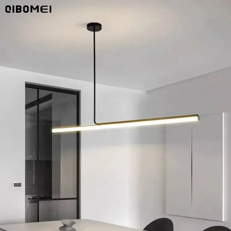 Minimalist gold and black metal pendant light with sleek cord pendant installation and slender led bar for dining room