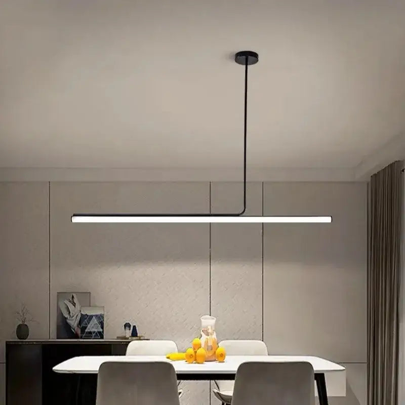 Modern black linear metal pendant light with minimalist design and cord pendant installation for dining room use