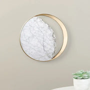 A minimalist gold and white moon wall lamp with a circular marble-like surface for living room decor