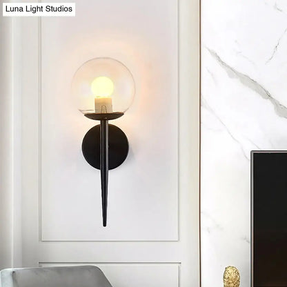Minimalist gold and black metal pencil arm wall sconce with clear glass globe and warm bulb for living room inch fixture