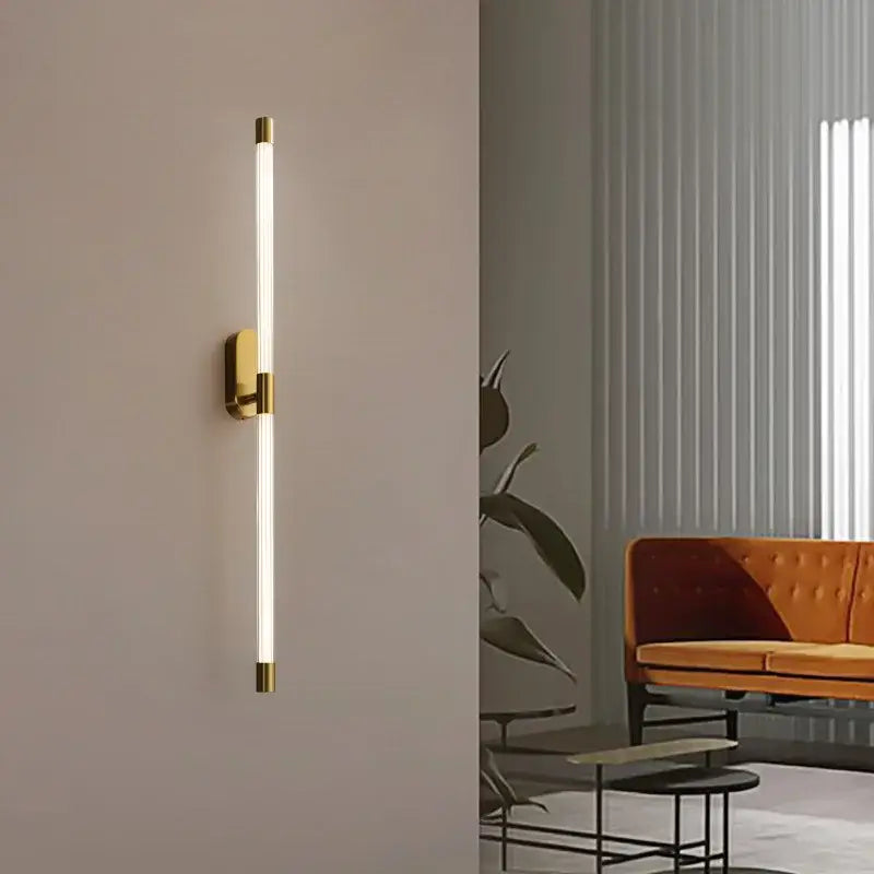 Minimalist gold-toned decorbites acrylic line led wall light with sleek vertical tube for bedroom lighting