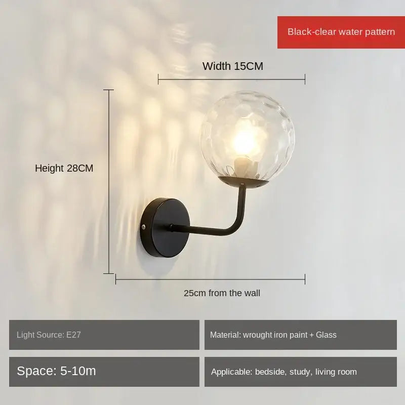 Black wrought iron wall lamp with decorbites glass ball led featuring textured black-clear water pattern globe