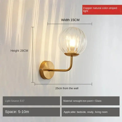 Copper-colored wall lamp with clear ribbed glass globe and elegant curved arm featuring decorbites glass ball led design