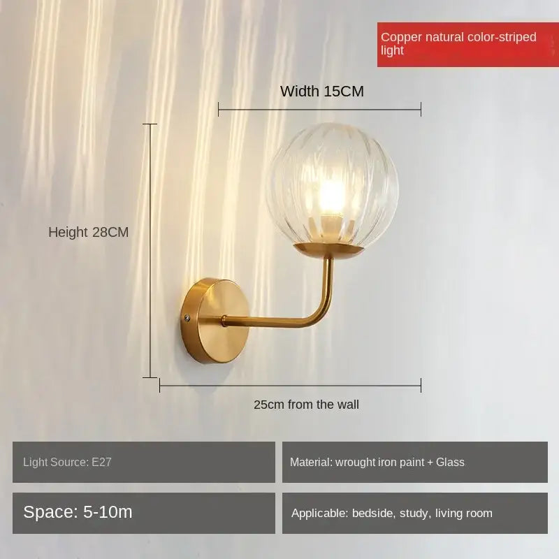 Copper-colored wall lamp with clear ribbed glass globe and elegant curved arm featuring decorbites glass ball led design