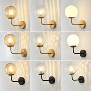 Minimalist gold and black metal wall lamp with decorbites glass ball led shades in clear textured and frosted finishes